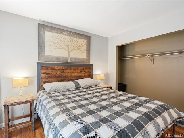 bedroom featuring hardwood / wood-style flooring and a closet