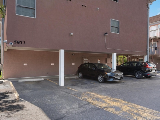 5873 S Prince St Unit 209B, Littleton, CO 80120 - view of partially covered parking lot