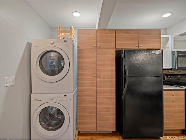 laundry room featuring stacked washer / dryer