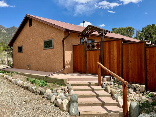 view of side of home featuring a mountain view