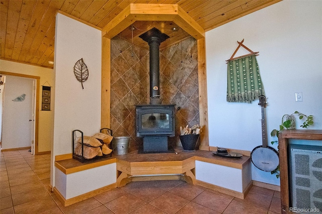 tiled living room featuring a wood stove and wooden ceiling