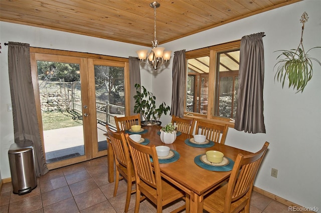 tiled dining area with french doors, an inviting chandelier, and wooden ceiling