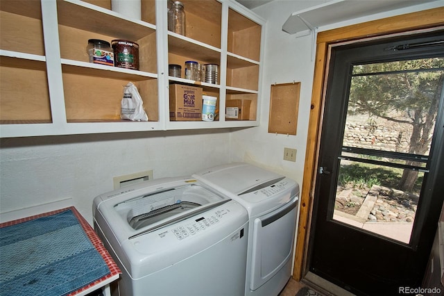 laundry room with washing machine and clothes dryer