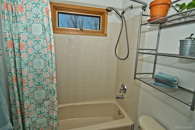 bathroom featuring toilet and shower / tub combo with curtain