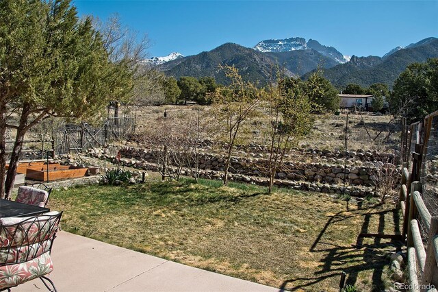 exterior space featuring a patio area and a mountain view