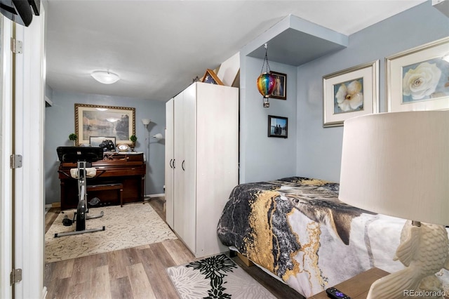 bedroom with wood finished floors