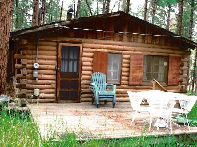 162 County Road-114, Bailey, CO 80421 - back of house with log exterior and a chimney