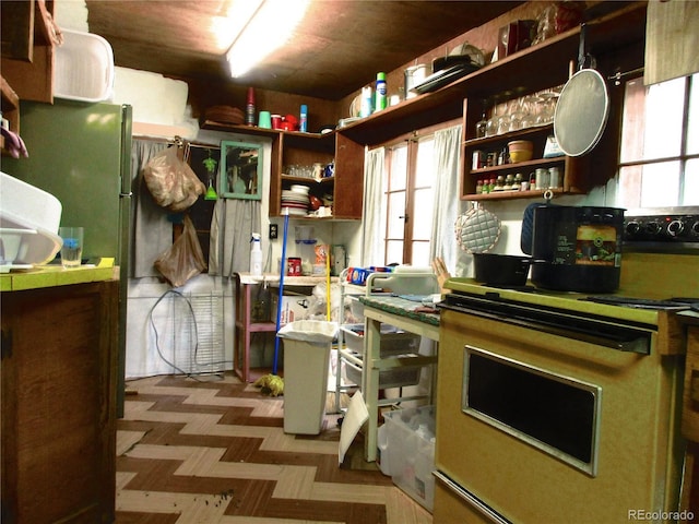 162 County Road-114, Bailey, CO 80421 - kitchen with range with electric stovetop, open shelves, tile patterned floors, and plenty of natural light