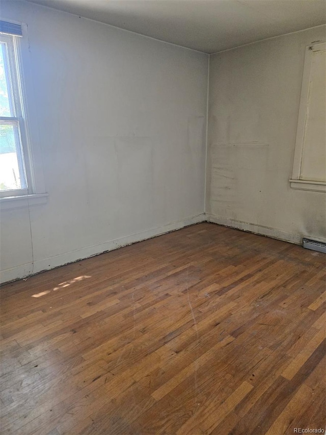 3350 S Eliot St, Englewood, CO 80110 - spare room featuring wood-type flooring