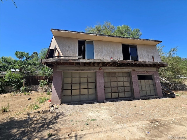 3350 S Eliot St, Englewood, CO 80110 - view of front of property with stucco siding and an attached garage