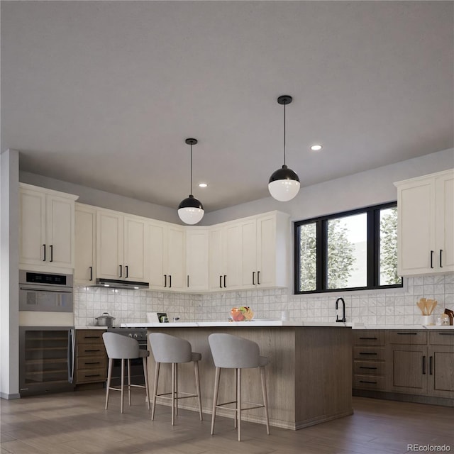 kitchen featuring a center island, dark wood-type flooring, pendant lighting, and white cabinetry