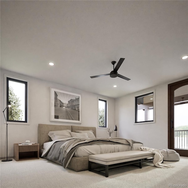 carpeted bedroom featuring multiple windows, ceiling fan, and access to outside