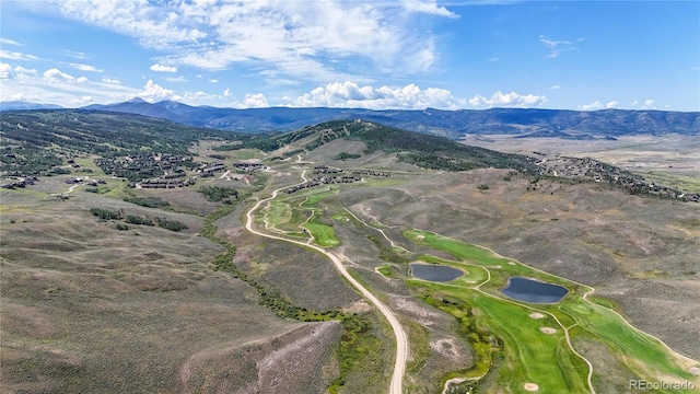 drone / aerial view featuring a mountain view