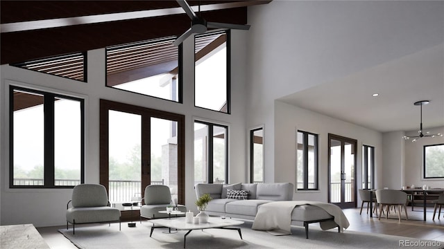 living room featuring french doors and an inviting chandelier