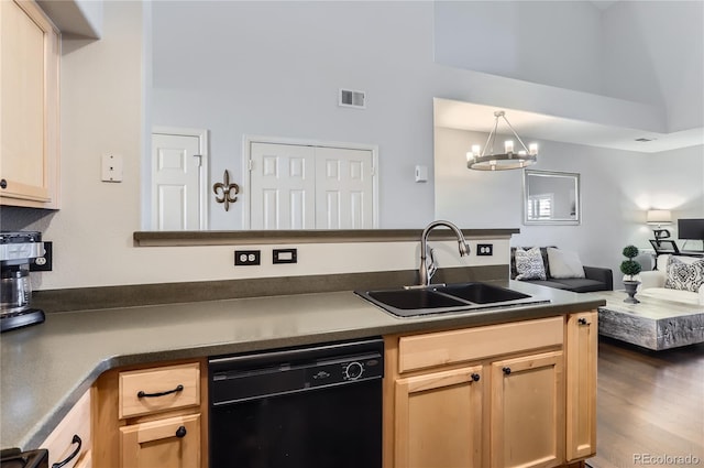 kitchen featuring a sink, dark countertops, light brown cabinets, and dishwasher