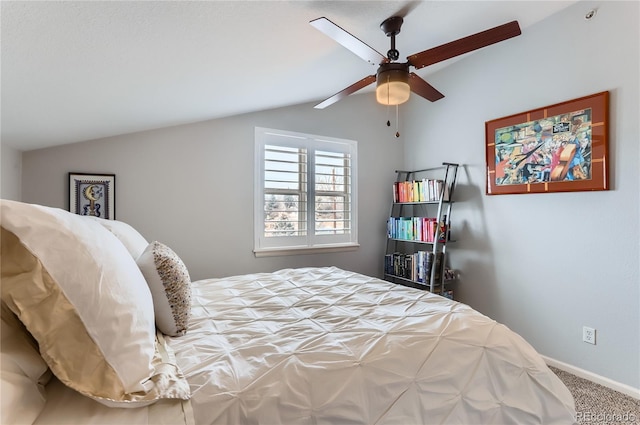 bedroom featuring vaulted ceiling, carpet flooring, a ceiling fan, and baseboards