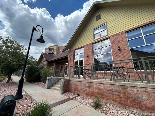 exterior space with brick siding