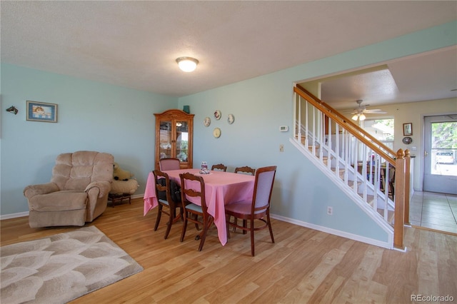 2296 E 109th Dr, Northglenn, CO 80233 - dining area with stairs, wood finished floors, baseboards, and a ceiling fan