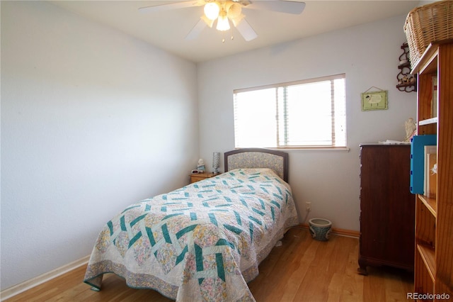 2296 E 109th Dr, Northglenn, CO 80233 - bedroom with wood finished floors, baseboards, and a ceiling fan