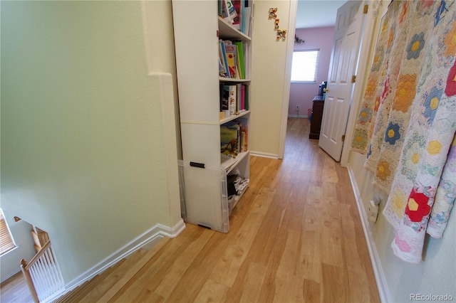 2296 E 109th Dr, Northglenn, CO 80233 - hallway featuring light wood finished floors and baseboards