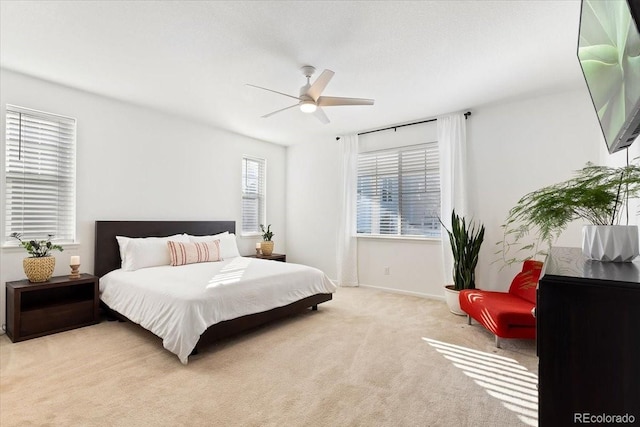 carpeted bedroom with ceiling fan