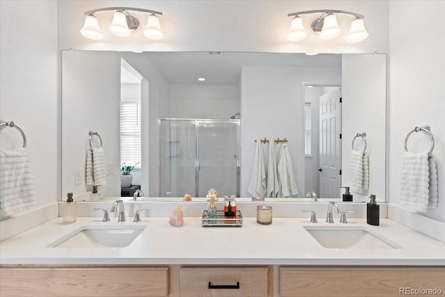 bathroom with walk in shower and vanity