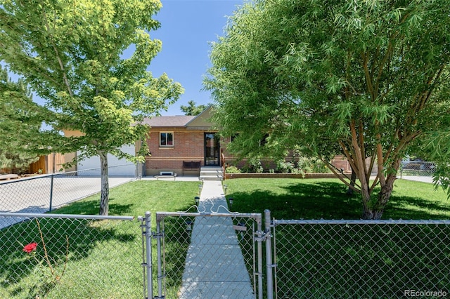 9170 Aspen Dr, Thornton, CO 80229 - view of front of property featuring a gate, brick siding, concrete driveway, and a garage