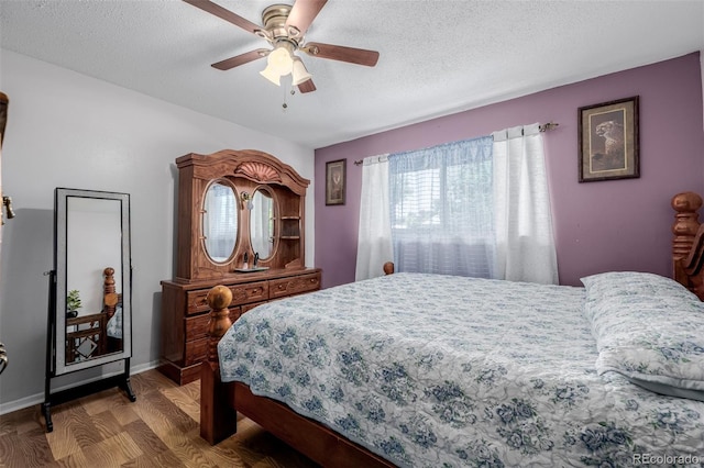 9170 Aspen Dr, Thornton, CO 80229 - bedroom featuring wood finished floors, a textured ceiling, and a ceiling fan