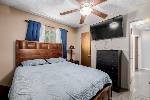 9170 Aspen Dr, Thornton, CO 80229 - bedroom with wood finished floors, a textured ceiling, and ceiling fan