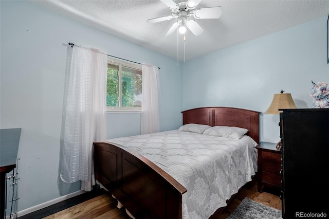 9170 Aspen Dr, Thornton, CO 80229 - bedroom featuring wood finished floors, a textured ceiling, and ceiling fan