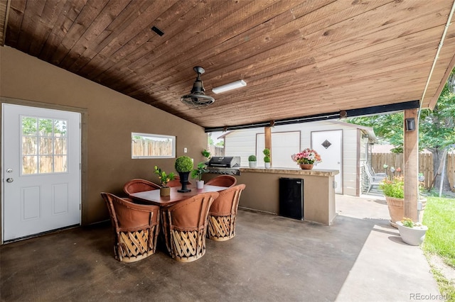 9170 Aspen Dr, Thornton, CO 80229 - dining room featuring wooden ceiling, concrete flooring, and vaulted ceiling