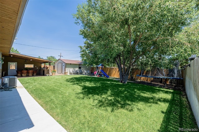 9170 Aspen Dr, Thornton, CO 80229 - fenced backyard featuring a storage unit, a playground, and a patio