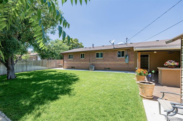 9170 Aspen Dr, Thornton, CO 80229 - back of house with brick siding and a patio
