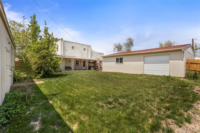 1400 S Knox Ct, Denver, CO 80219 - view of yard with a garage