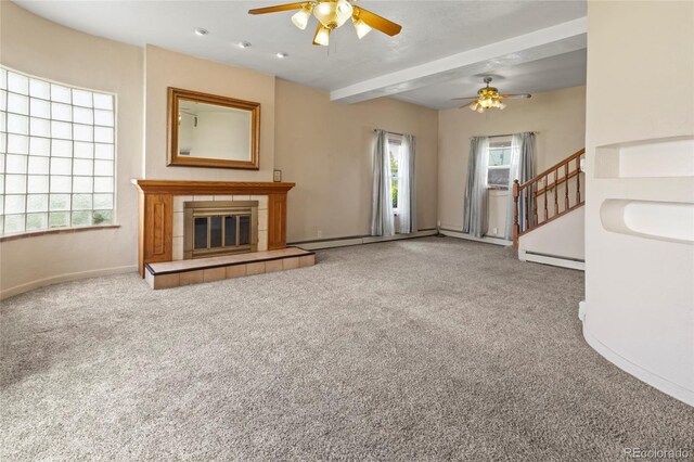 1400 S Knox Ct, Denver, CO 80219 - unfurnished living room featuring ceiling fan, a baseboard radiator, healthy amount of natural light, and carpet floors