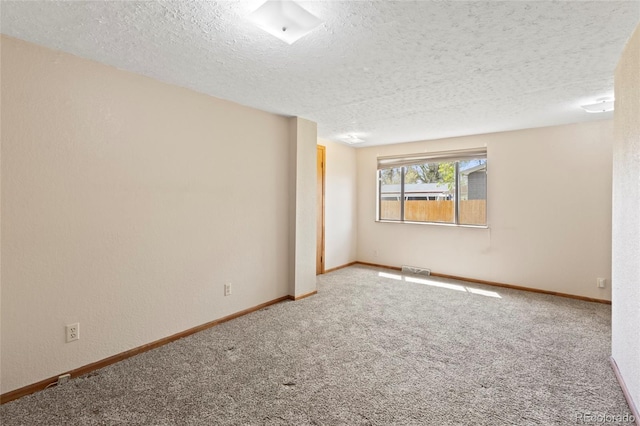 1400 S Knox Ct, Denver, CO 80219 - unfurnished room featuring carpet, a textured ceiling, and baseboards