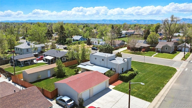 1400 S Knox Ct, Denver, CO 80219 - aerial perspective of suburban area with a mountain backdrop