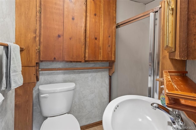 1400 S Knox Ct, Denver, CO 80219 - full bath with a stall shower, a sink, and toilet