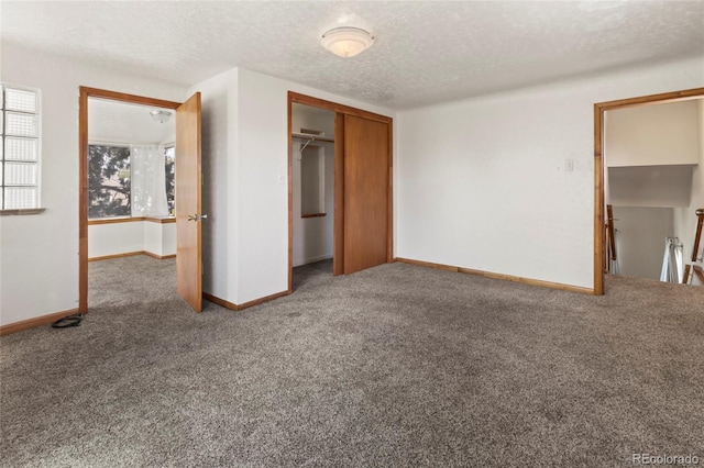 1400 S Knox Ct, Denver, CO 80219 - unfurnished bedroom featuring carpet floors, a textured ceiling, baseboards, and a closet