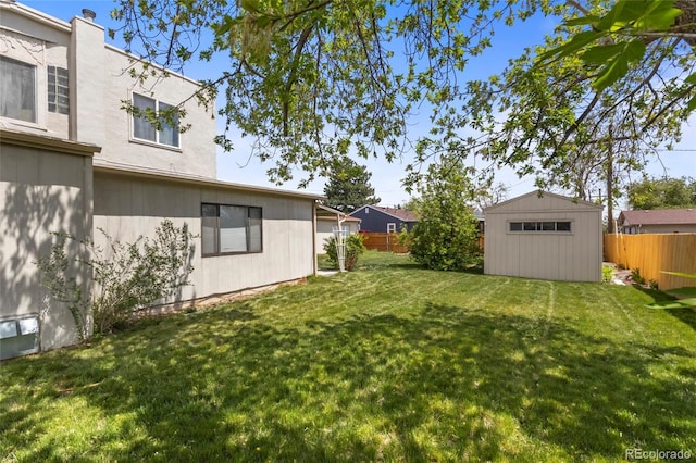 1400 S Knox Ct, Denver, CO 80219 - view of yard featuring an outbuilding and a storage shed