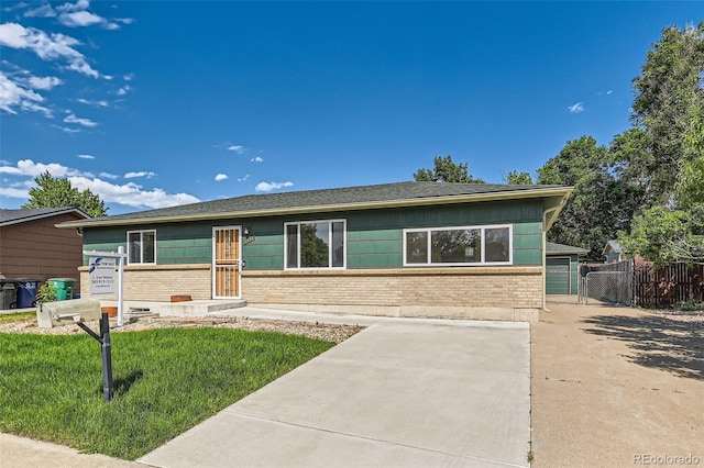 5556 Vaughn St, Denver, CO 80239 - ranch-style house with brick siding