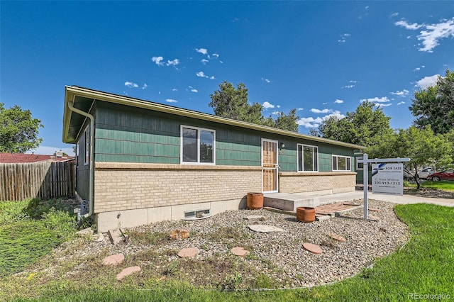 5556 Vaughn St, Denver, CO 80239 - view of front facade with brick siding