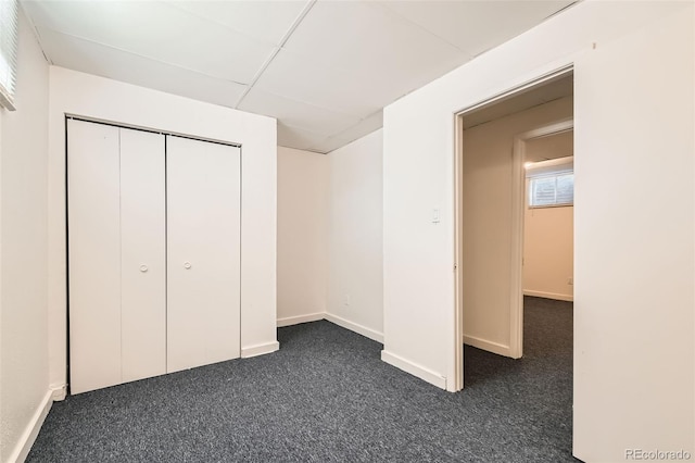 5556 Vaughn St, Denver, CO 80239 - unfurnished bedroom featuring dark carpet and a closet