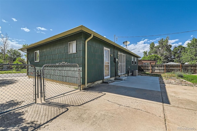 5556 Vaughn St, Denver, CO 80239 - view of home's exterior with a gate and a patio
