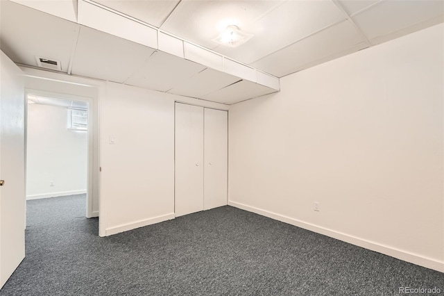 5556 Vaughn St, Denver, CO 80239 - finished basement with dark carpet and baseboards
