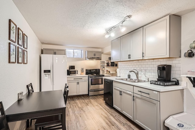 kitchen with gray cabinetry, dishwasher, white fridge with ice dispenser, sink, and stainless steel electric range