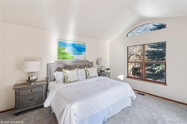 bedroom featuring lofted ceiling, carpet flooring, baseboards, and visible vents