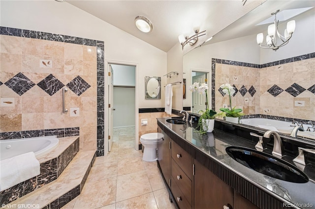 bathroom featuring an inviting chandelier, tile walls, lofted ceiling, and a sink