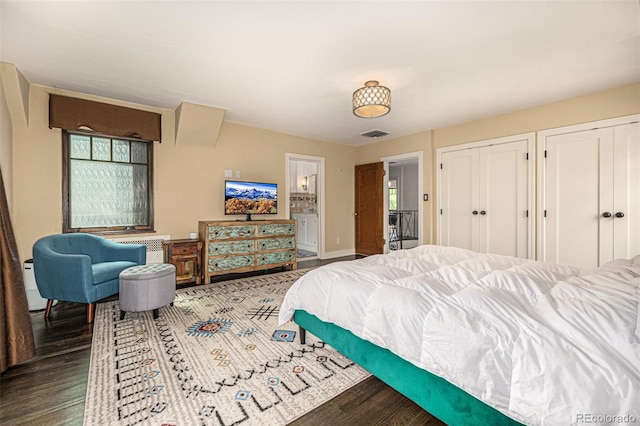 1795 N Monaco St Parkway, Denver, CO 80224 - bedroom featuring wood finished floors, two closets, baseboards, and ensuite bathroom
