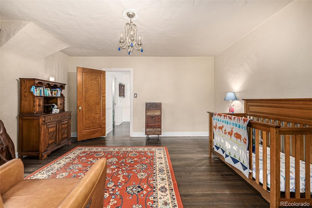 1795 N Monaco St Parkway, Denver, CO 80224 - bedroom featuring a chandelier, baseboards, and wood finished floors